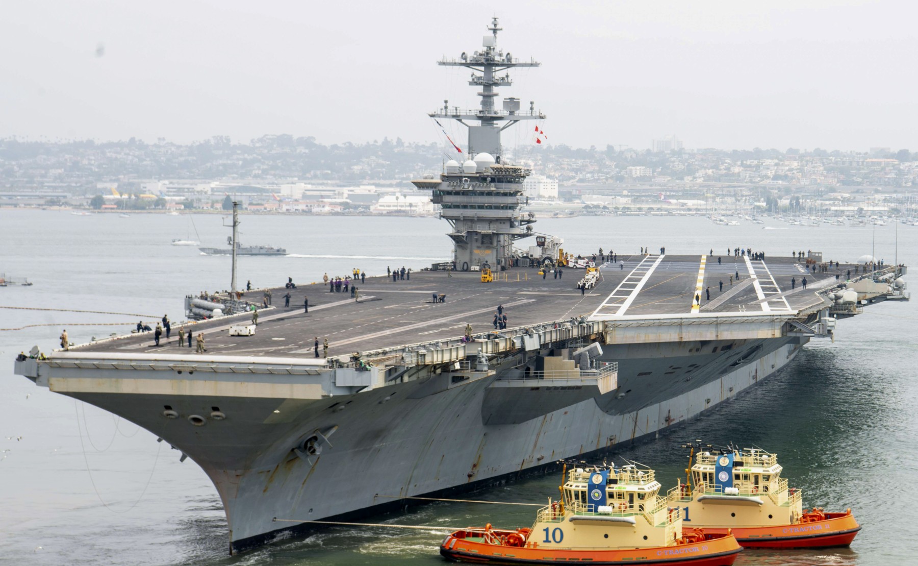 cvn-72 uss abraham lincoln nimitz class aircraft carrier departing san diego july 2024