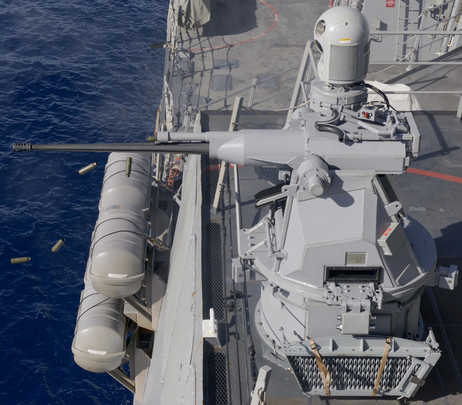 ddg-90 uss chafee arleigh burke class guided missile destroyer mk.38 mod.2 machine gun fire 53